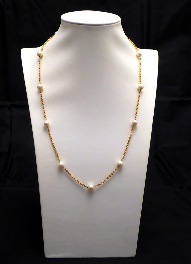 14k Gold and Pearl Necklace: 14k gold and pearl necklace with spring ring clasp. Perfectly round pearls. Stamped 14k gold on clasp. Dainty. L 20-1/2 in. Condition: Excellent condition. Clasp is in working order. No da