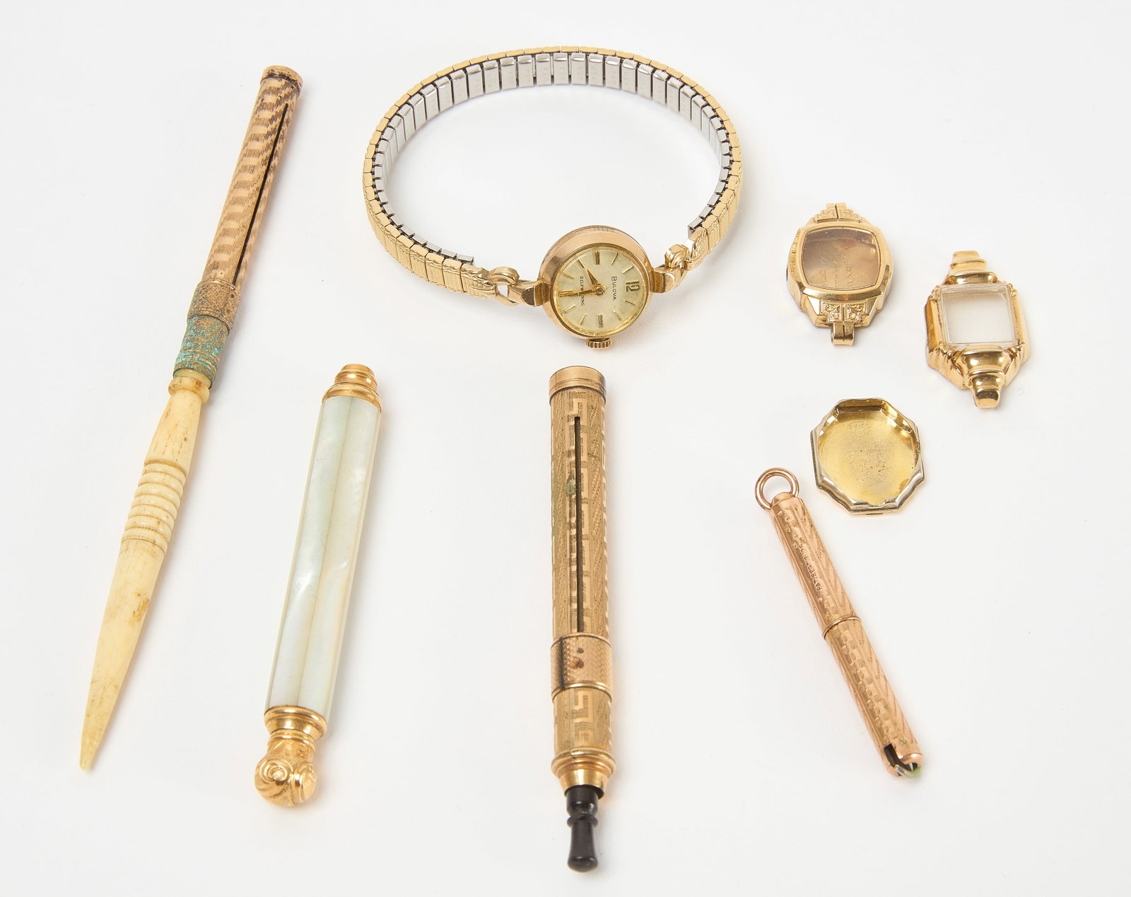 Group of Gold-Filled and Plated Jewelry: Group of gold-filled jewelry, some costume. 5 pairs of clip-on earrings, 2 brooches, and 1 gold costume jewelry necklace. Makers include: Van Dell. Necklace chain is stamped 14k. 1 gold plated Bulova 