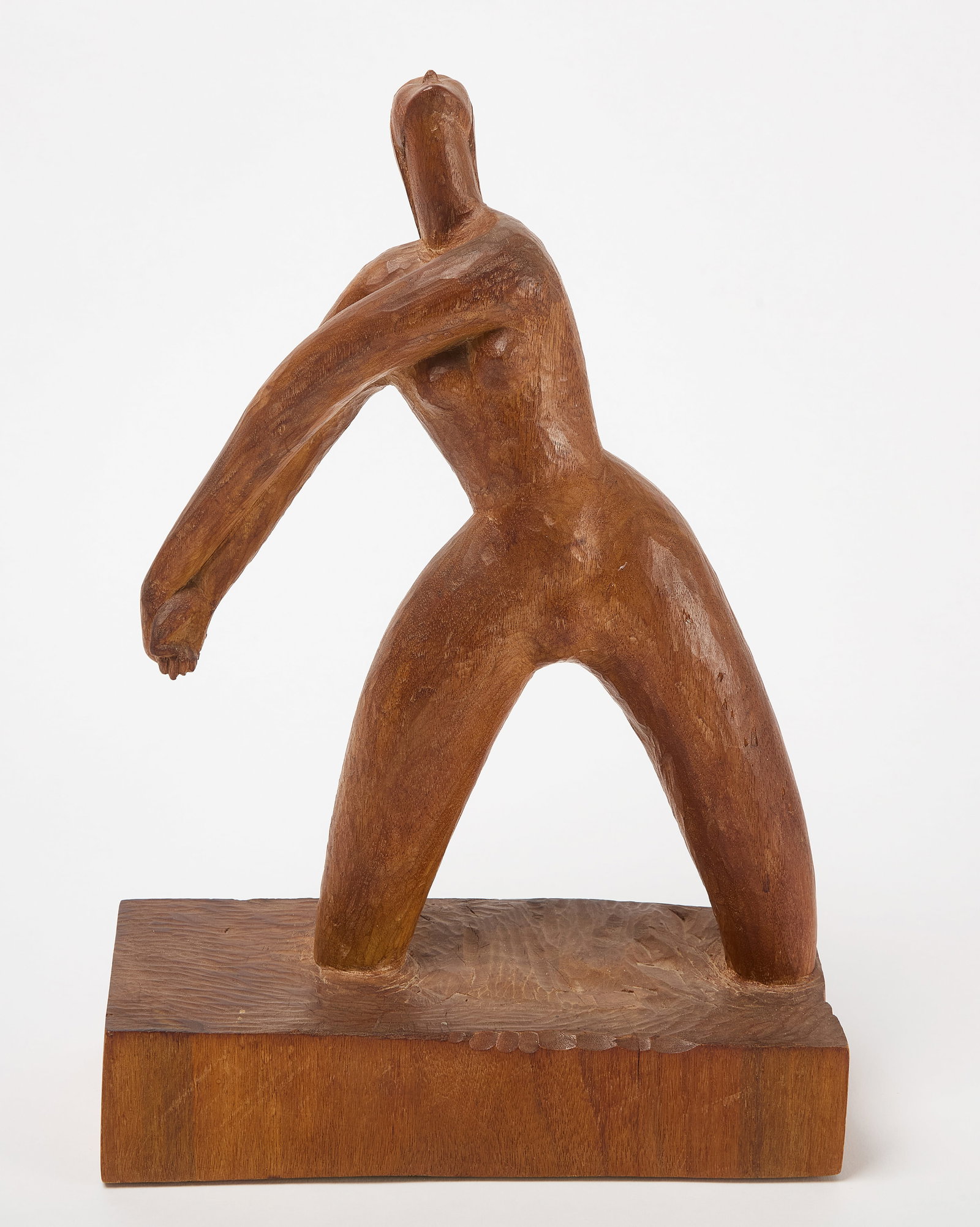 Modernist Figure of a Woman: Modern sculpture of a woman. Carved wood. American, circa 1960. H 15-5/8 in. W 10-7/8 in. D 4-1/2 in. Condition: Minor chip to clasped hands. Minor surface wear to base of sculpture. Please see 