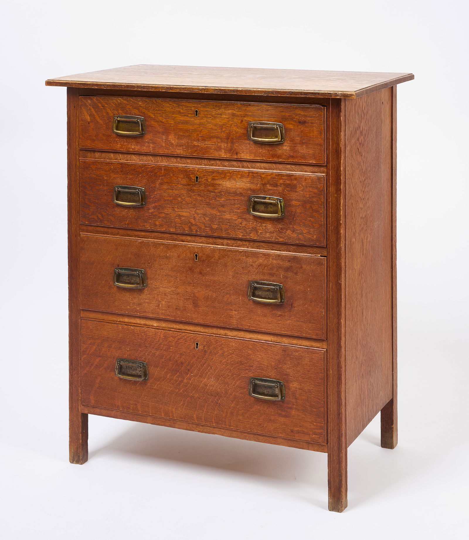 Ambrose Heal Chest No. 402: Rare Ambrose Heal oak chest with four drawers. Hand-hammered drawer pulls and hand-cut dovetails. Four graduated drawers with individual dust covers. English, circa 1904. Please see: Sir Ambrose Heal