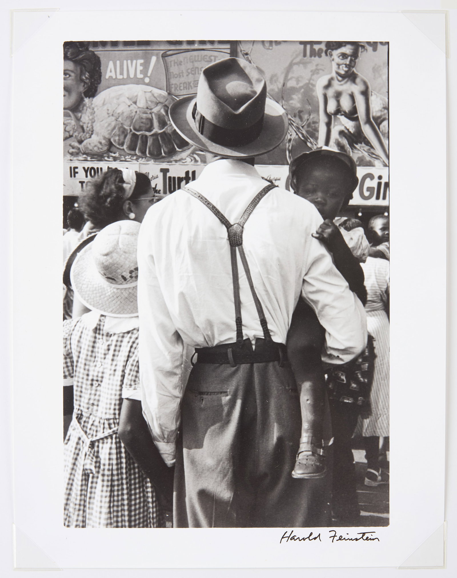Harold Feinstein - Man and Daughter at Coney Island Side Show, 1949, 1/20: Harold Feinstein (1931-2015) - 'Man and Daughter at the Side Show, Coney Island'. Artist signed silver gelatin print, dated 1949 on verso and numbered 1/20. In archival mat. Photo: H 13-3/4 in
