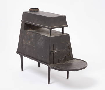 Shaker Cast Iron Stove: Shaker 3-part community stove, cast iron. Original turned wood knob on fire door, original two-sectioned flue, pipe with damper, and removable tapered feet. Vent pipes included (contemporary). New Eng