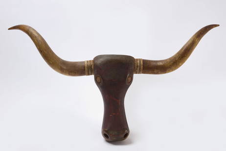 Carved and Painted Steer Head: Carved and painted steer head in original oxblood red paint. Real horns. American, late 19th century. L 16-1/4 in. W 41-1/2 in. Condition: Good surface. Minor imperfections. Link to high-res images: h