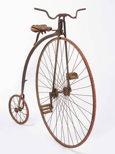 High-Wheel Bicycle: High-wheel bicycle. American, mid 19th century.H 53-3/4 in. L 57-1/2 in. Front wheel: D 42 in. Condition: Surface imperfections and wear from age. Surface rust, seat with tears. Please