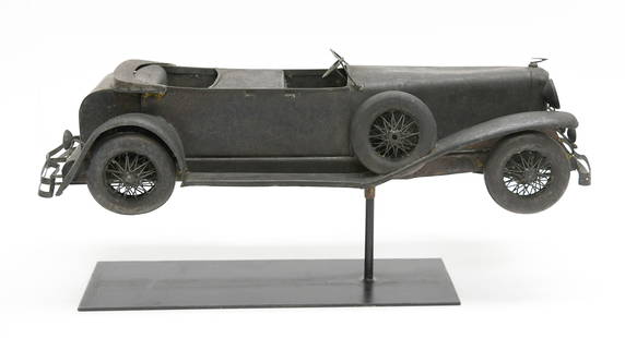 Duesenberg Phaeton Weathervane: Duesenberg Phaeton weathervane. Copper with traces of gold leaf. Display stand included as shown. American, circa 1930.L 28 in. W 9 in. D 9 in. Condition: Minor surface imperfections