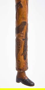 Folk Art Carved Walking Stick with Animals and Shoe Foot: A folk art carved walking stick with a myriad of animals throughout the entire stick. The bottom is carved to resemble a shoe. The cane is dated. American, 1927. L 32-1/2 in. Condition: Old hist