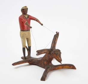 Folk Carving of a Man Riding a Creature