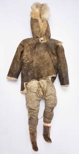 Eskimo Child's Outfit: Child's outfit. Includes hooded parka, pants, and shoes. Hide, fur, and cloth. North America, 19th century. Parka: L 34-1/2 in. WÂ 24 in. Pants: L 22 in. W 13 in. Shoes: H 6-1/4 in
