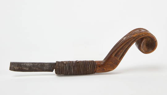 Heart and Chevron Crooked Knife: Crooked knife with chevron design and carved heart. Likely Penobscot or Mik&rsquo;maq. Wood, leather, nails, and re-worked steel blade (likely a straight edge razor). North America (Eastern Woodlands)