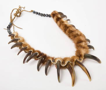 Bear Claw Necklace: Native American bear claw necklace. Claws, beads, hide and red pigment. North America, early to mid 20th century. L 36 in. outstretched. Condition: No damage noted. Link to high-res images: https