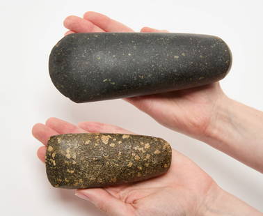 Two Native American Pounder Stones: Two Native American pounder stones. One with archival text 'Swan Creek Site, Walworth Co(unty), S.D....PG-428'. Porphyry stone. North America, L 6-3/4 in. and L 4-3/8 in. Condition: