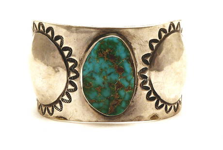Navajo Statement-Stone Cuff Bracelet: Vintage Navajo silver and stone bracelet. Stone is a statement piece of turquoise. Southwestern U.S., 20th century. 2.93 ozt. H 1-5/8 in. W 2-3/4 in. D 1-5/8 in. Inner width: