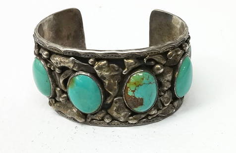 Native American Silver Cuff with Turquoise: Native American brutalist silver cuff bracelet with 6 oval turquoise stones. Unsigned. American, circa 1960. 3.21 ozt. H 1-1/2 in. W 2-3/4in D 2 in. Opening 2-1/2 in x 2 in. Conditio