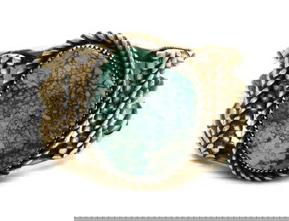Navajo Silver and Turquoise Bracelet: Navajo vintage heavy silver and turquoise bracelet. Large high quality stone. Southwestern U.S., 20th century. H 1-3/4 in. W 2-1/2 in. D 2-1/8 in. Inner width: 2-1/4 in. Inner depth: 1-3/4