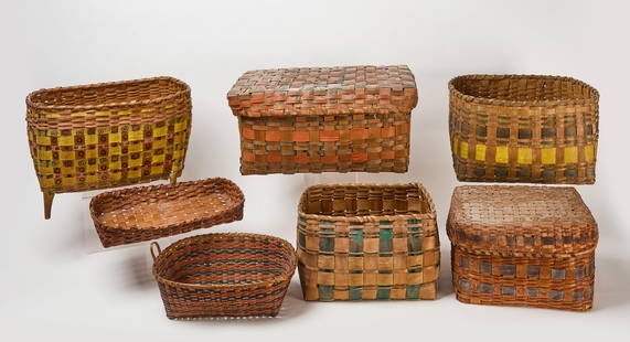 Seven Native Splint Baskets: A group of seven splint baskets. First two have&nbsp;teal and yellow painted wefts. The largest splint basket is lidded with orange and blue painted wefts. The next is a handled basket with orange and
