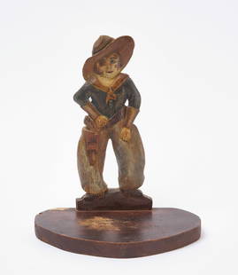 Folk Art Carved Cowboy Shelf: Folk art cowboy figure on a shelf. Carved wood with original paint. American, early 20th century. H 9-3/4 in. W 8-3/8 in. D 5 in. Condition: Minor surface wear as expected. No restoration noted. Some
