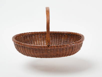 Oval Nantucket Swing-Handle Basket: Oval Nantucket swing-handle basket. American, late 19th century. (Handle up) H 7-3/4 in. W 12 in. D 10 in. Condition: Minor surface imperfections commensurate with age. Link to high-res images:&nbsp;h