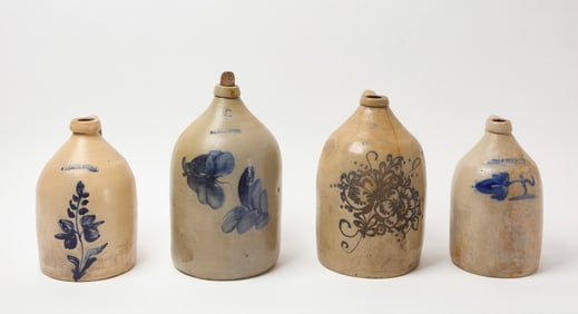 Four Stoneware Jugs with Flowers
