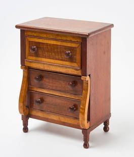 Miniature Three-Drawer Sheraton Chest: Miniature Sheraton chest. Tiger maple and mahogany with three drawers. American, late 19th century. H 14-3/8 in. W 9-3/4 in. D 7-1/4 in. Condition: Minor surface imperfections. Overall very good.
