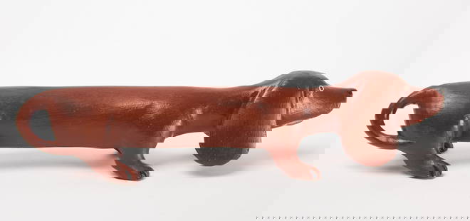 Folk Art Dachshund Figure: Folk art carved and hand-painted wooden figure of a dachshund dog.&nbsp; American, mid 20th century. H 3-1/2 in. L 16 in. W 3-1/2 in. Condition: Very good with minor wear. Link to high-res images: htt