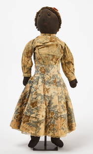 Afro-American Rag Doll in Blue Floral Dress: Afro-American rag doll in blue floral dress. Fabric doll with original dress, underskirt, bloomers, and bonnet. Bloomer and underskirt with button closure and trimmed with lace. Dress fastens with met