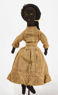 Afro-American Rag Doll with Long Hair: Afro-American rag doll with long hair. Fabric doll with dress, and lace trimmed underskirt and bloomers. Embroidered facial features. Yarn hair tied back with a ribbon bow. American, 19th century