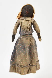 Afro-American Rag Doll in Blue Polka Dot Skirt Set: Afro-American rag doll in blue polka dot skirt set. Fabric doll and clothing with button eyes and embroidered mouth. Wearing matching blue polka dot skirt and top trimmed with embroidered ribbon