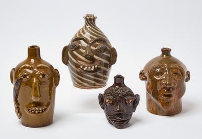Four Signed Face Jugs