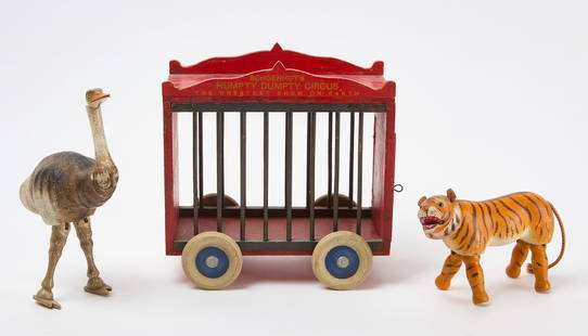 Schoenhut Humpty Dumpty Circus Wagon with Tiger and Ostrich: Three Schoenhut pieces. A &#39;Humpty Dumpty Circus&#39; wagon, together with a tiger and an ostrich (closed beak, Style II). American, circa 1910. H 10 in. W 9-3/4 in. D 5-1/4 in. H 5-1/8 in. L 7-1/8