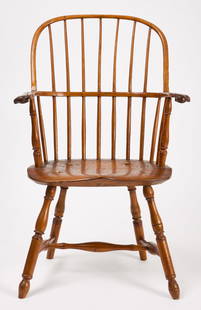 Knuckle Arm Windsor Chair: Windsor sack back arm chair with knuckle arms. Pennsylvania, circa&nbsp;1780. H 39-1/4 in.&nbsp;W 24-1/2 in.&nbsp;D 19 in.&nbsp;SH 17-1/4 in. Condition: Tight seat cracks. Imperfections. Replacements.