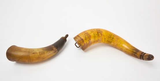 Two Carved Powder Horns
