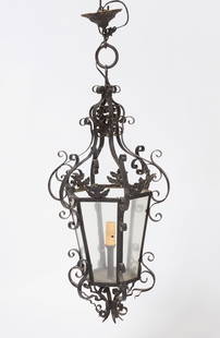Iron Lantern Hanging Fixture: Iron lantern hanging light fixture. French, circa 1920. H 36 in. W 16-3/4 in. Condition: Wear commensurate with age. Spots where paint has chipped off.&nbsp;