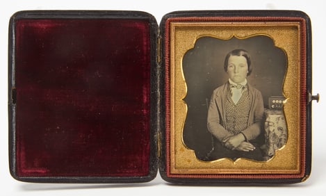 Daguerreotype of a Boy seated next to a Concertina