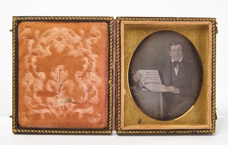 Daguerreotype Portrait of a Doctor Displaying a Book with Medical Instruments