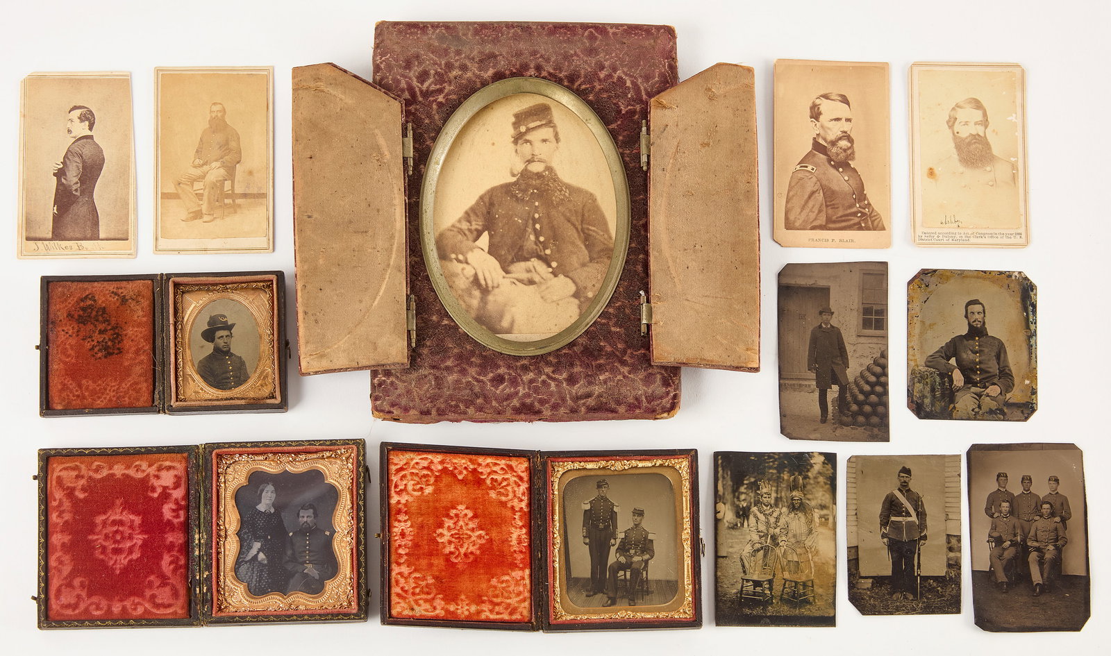 Large Group of Military Images and Others: A large group of 13 military and other images with adjacent subject matter, spanning CDV format, cabinet card, and tintype. One cabinet card in a period frame with purple flocking, double hinged doors