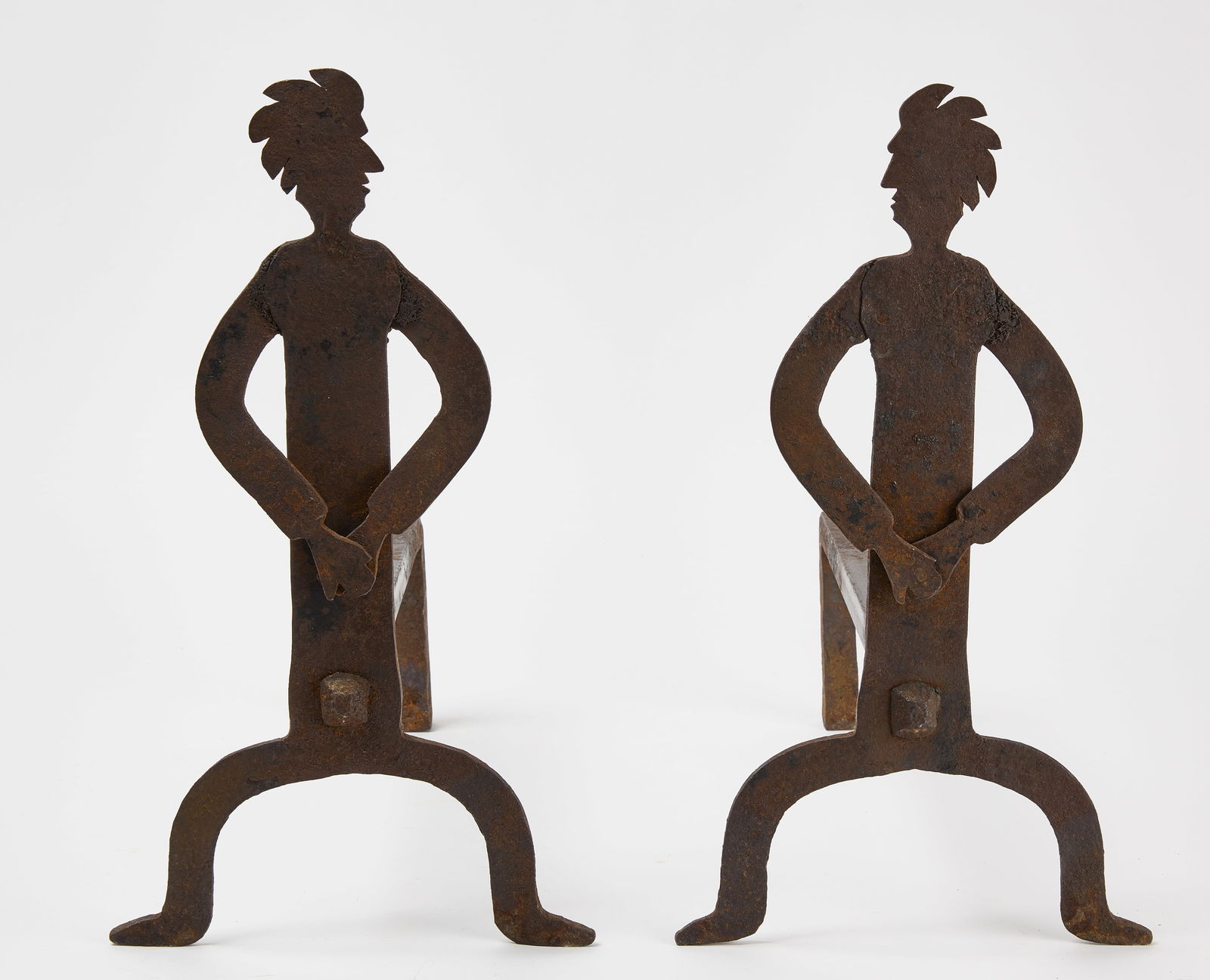 Pair of Folk Art Andirons: Pair of folk art andirons depicting Native Americans. Wrought iron. American, circa 1920. H 17-1/8 in. L 15 in. Link to high-res images: https://www.dropbox.com/sh/1oq728l2j1q3eyg/AACZLubwmFY3L_8
