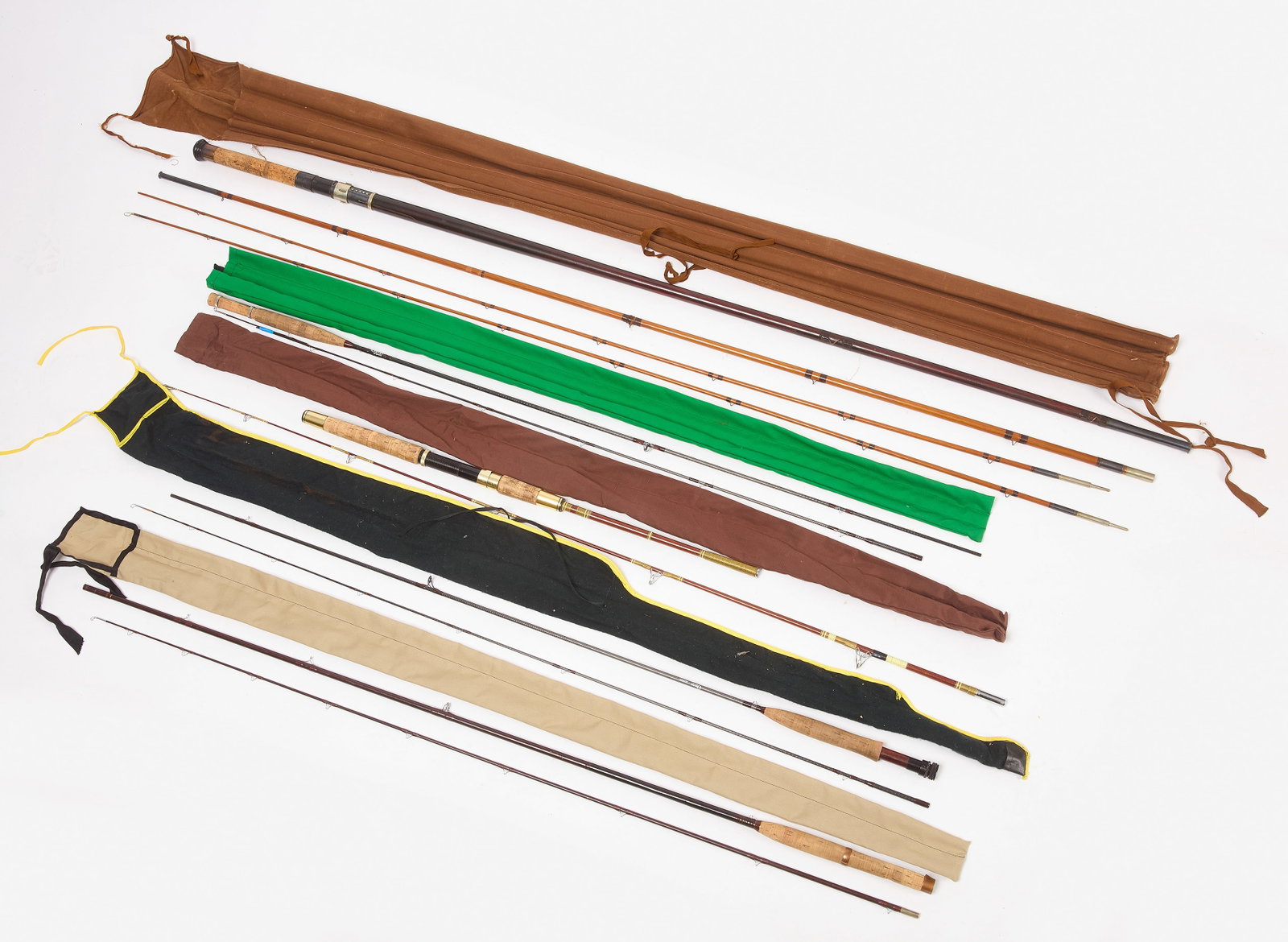 Group of Vintage Fishing Rods: Group of vintage fishing rods in sleeves. Approx Lengths 8 ft to 12 ft., varying.