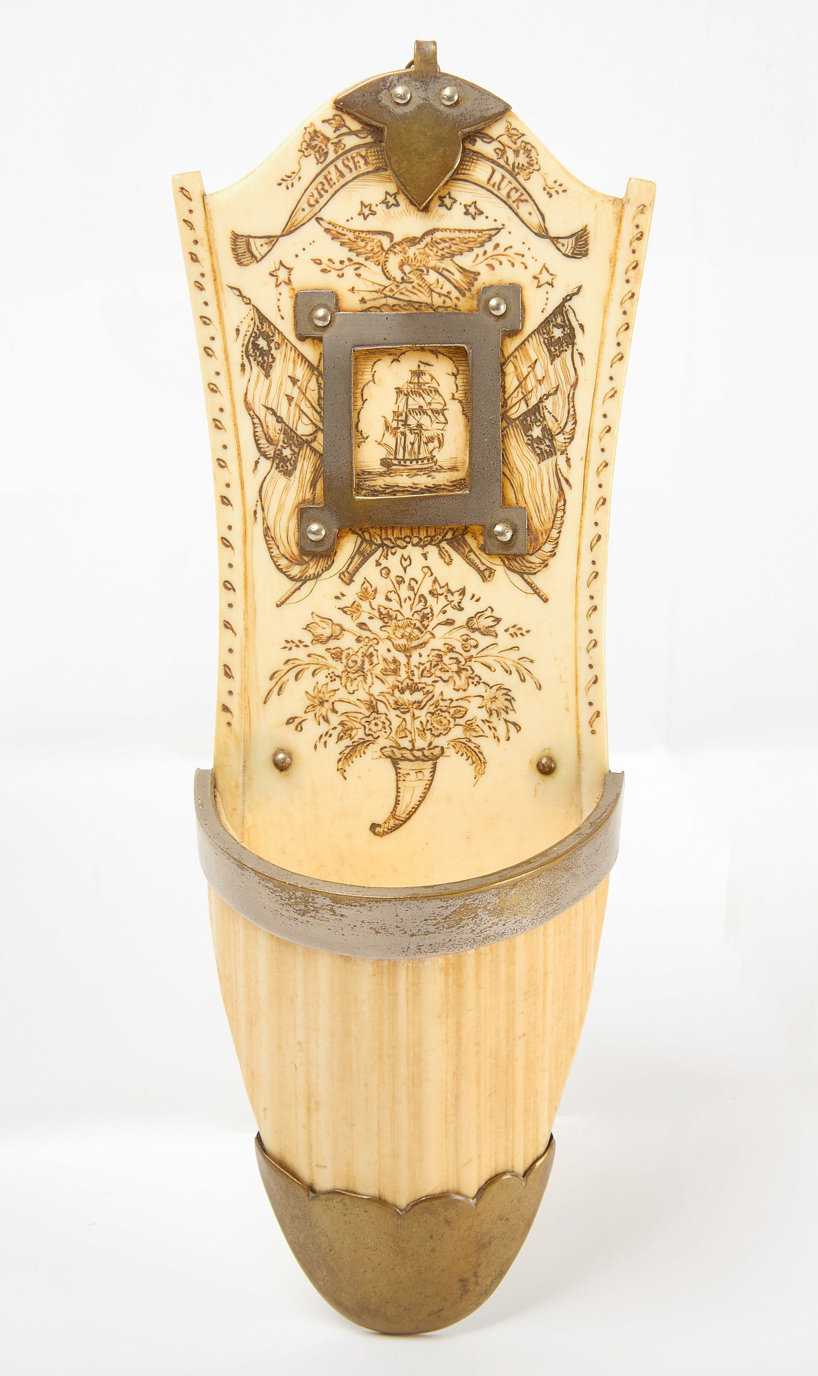 Scrimshaw Wall Pocket: Scrimshaw wall pocket with silverplated hardware. Carved bone. New England, late 19th century. L 7-1/2 in. W 2-1/2 in. 