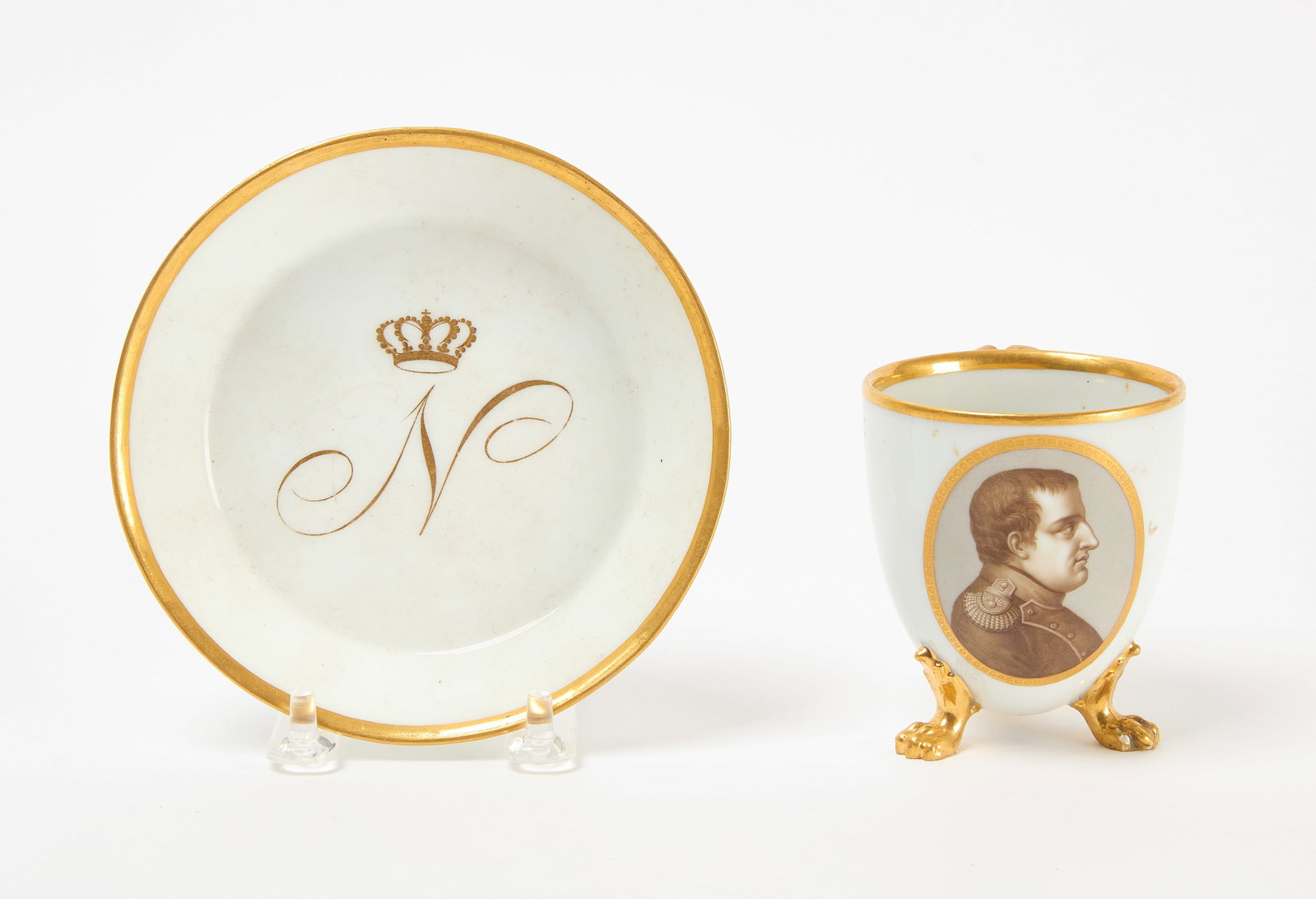 Meissen Napolean Cup and Saucer: Meissen Napolean porcelain cup and saucer. Cup: H 3-1/8 in. Saucer: D 5-1/4 in.