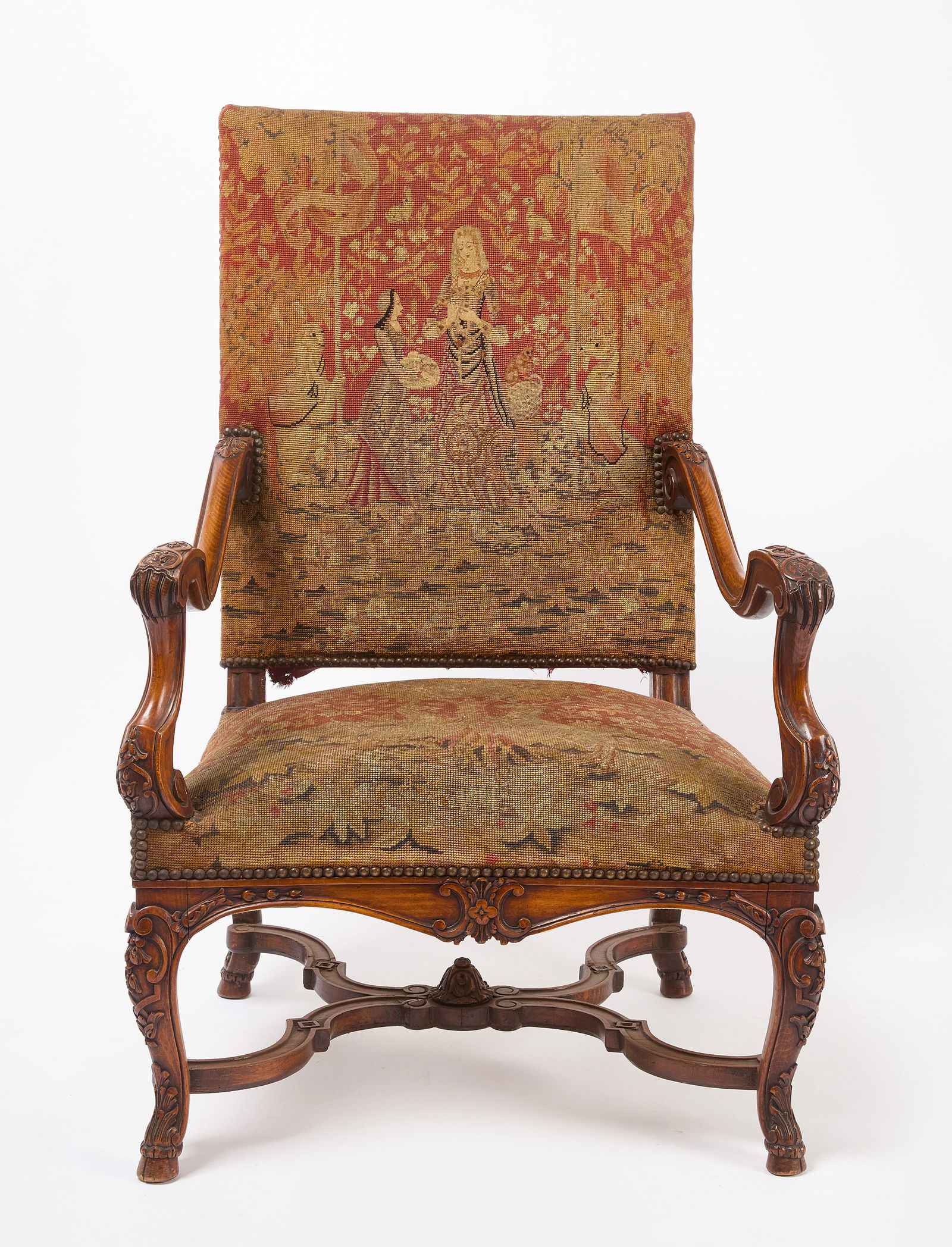 Carved Armchair: Carved armchair with hoof feet. Needlepoint seat and back. English, late 19th century. H 45 in. W 29 in. D 26 in. Link for high-res images: https://www.dropbox.com/scl/fo/060j7x0z9umo9eu0m1ev1/AN