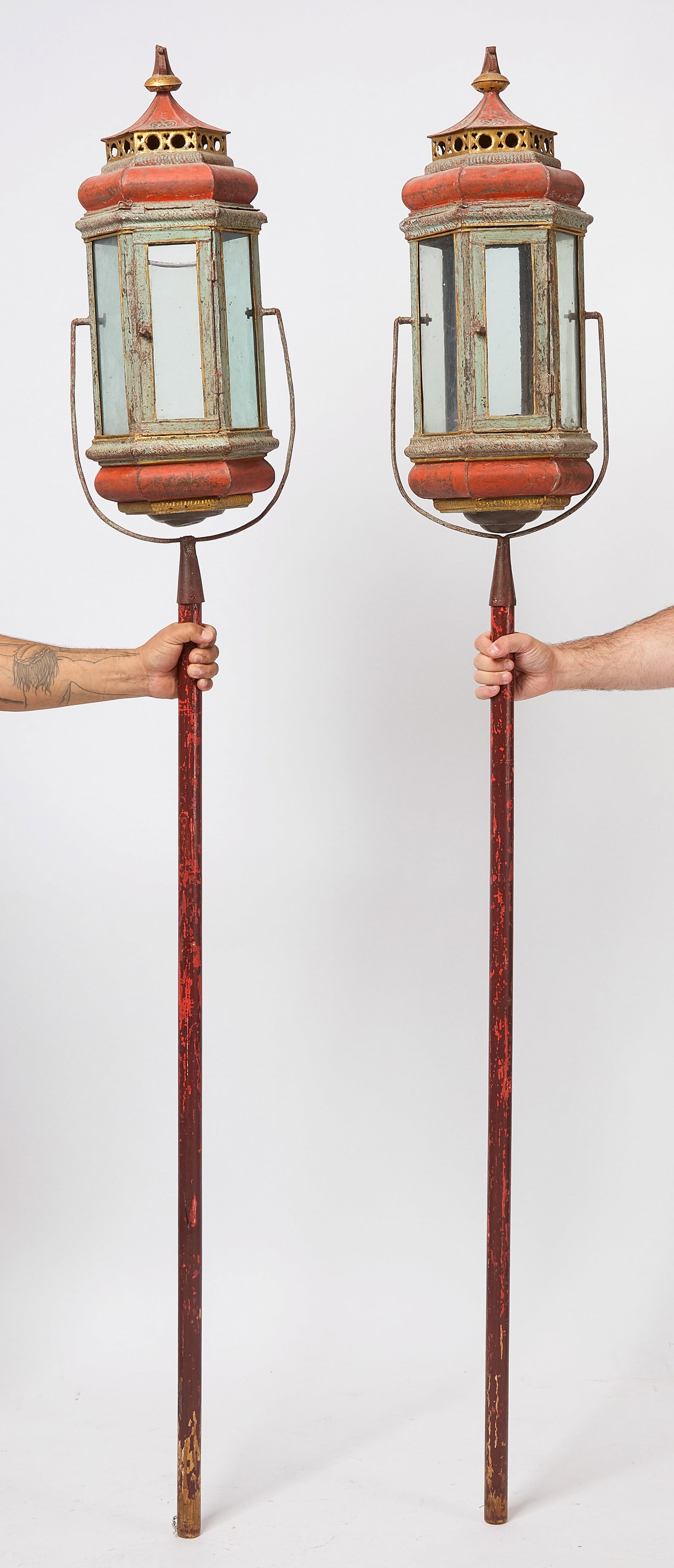 Pair of Pole Lanterns: Pair of Asian lanterns on swinging poles. H 79 in. Lantern only: H 26 in. W 10 in. D 10 in.