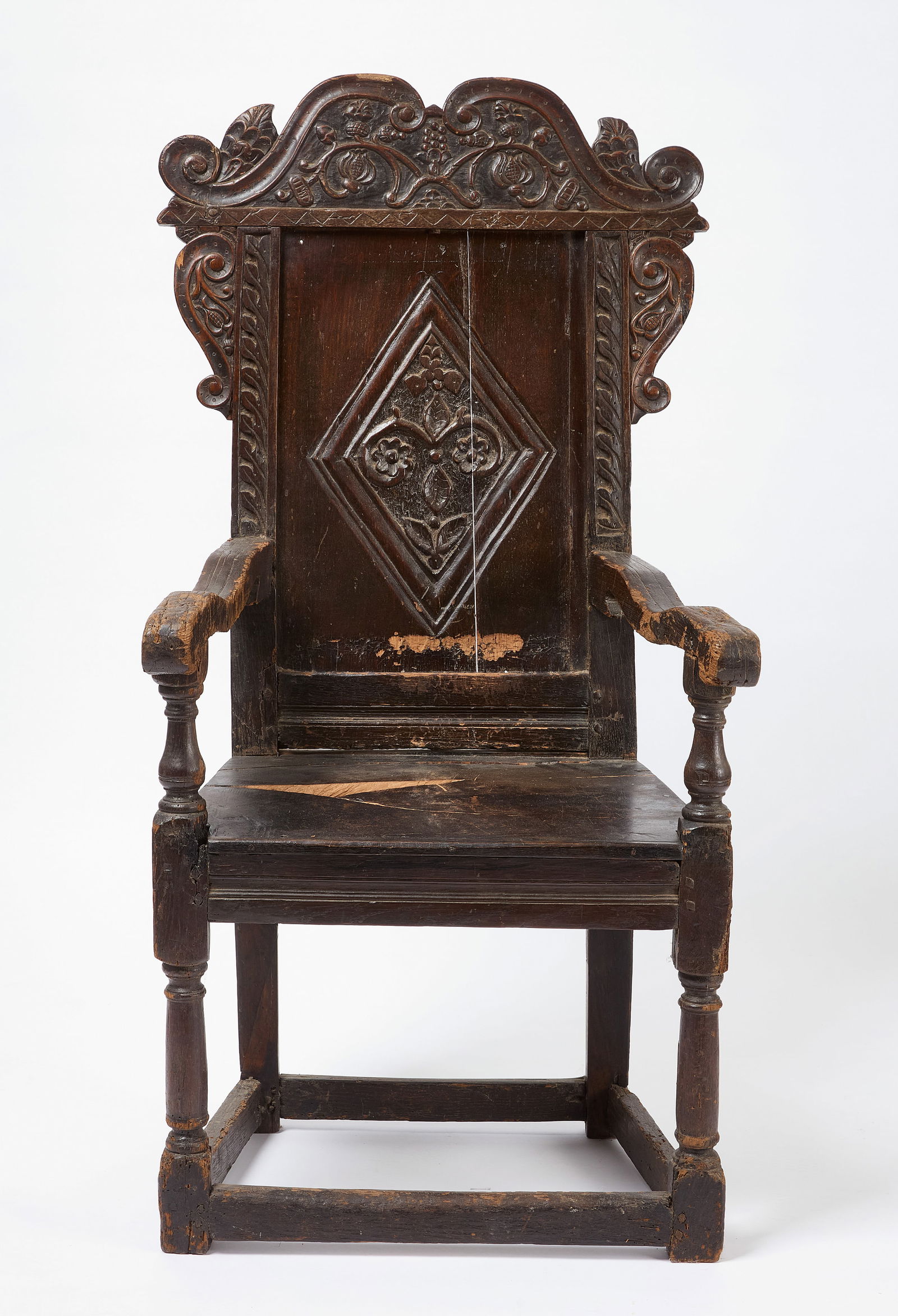 Wainscott Chair: Wainscott chair. Carved walnut, Late 17 or early 18th century. H 46 in. W 23 in. D 19-3/4 in. SH 16-1/2 in. Condition: Damage and loss to seat. Surface wear noted throughout. Link to hi-res images: