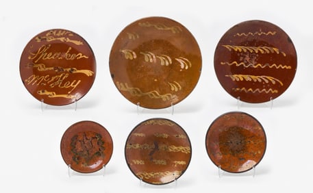 Six Redware Slip Decorated Plates