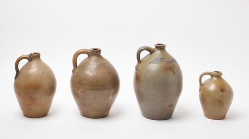 Four Ovoid Stoneware Jugs