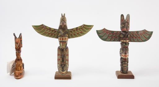Two Contemporary Totem Poles and Alaska Black Diamond Carving