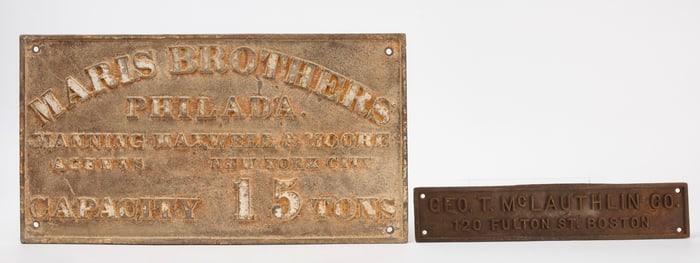 Two Cast Iron Signs