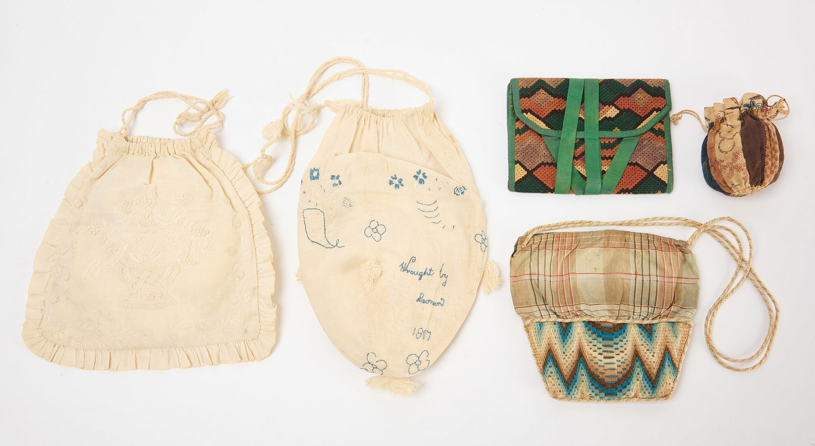 Group of Early Reticules: Group of four early reticules, and one embroidered ladies' wallet. All comprised of various textiles. Reticule One features embroidery that reads, "Wrought by Charlotte Leonard Godfrey 1807." American