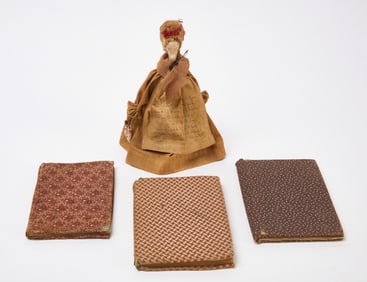 Three Fabric Covered Books and Clay-Pipe Doll