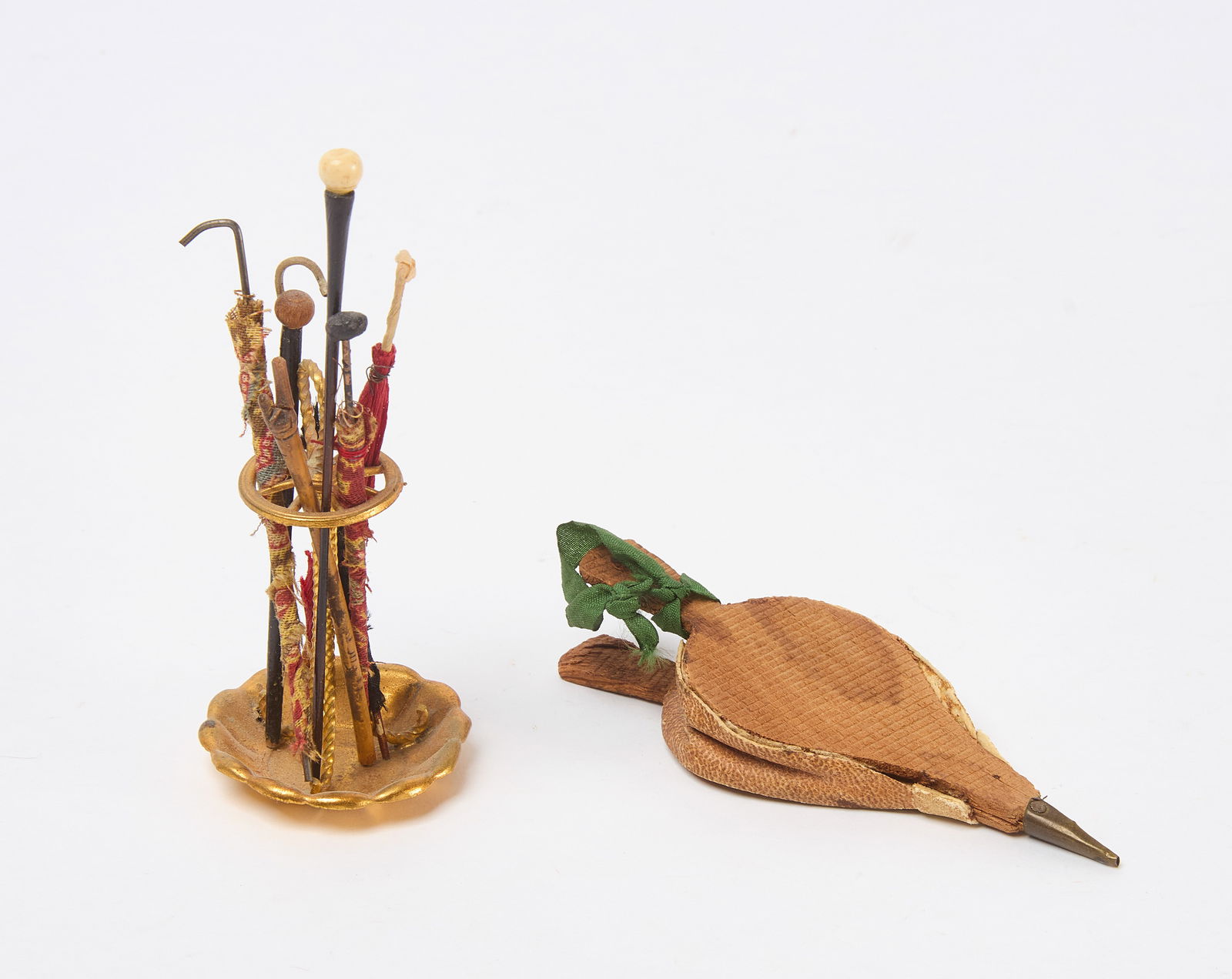Dollhouse Umbrella and Cane Stand, and a Bellows: Dollhouse umbrella stand with canes and umbrellas. Together with a dollhouse fire bellows. Provenance: Collection of Nancy Stass.