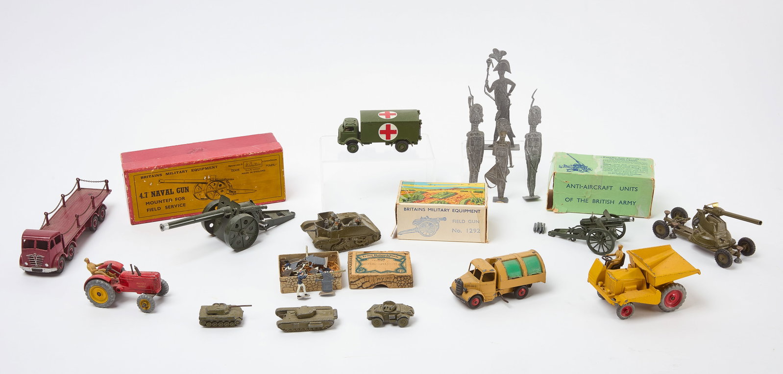 Group of Iron Toys - Dinky, Britain, and Others: Group of estate iron and lead toys which include Dinky, Ernst Heinrichsen, and W. Britain (England) toys. Boxed toys include Marine Artillery men, 2 Pounder Anti-Aircraft Gun (on Mobile Chassis), 4.7&